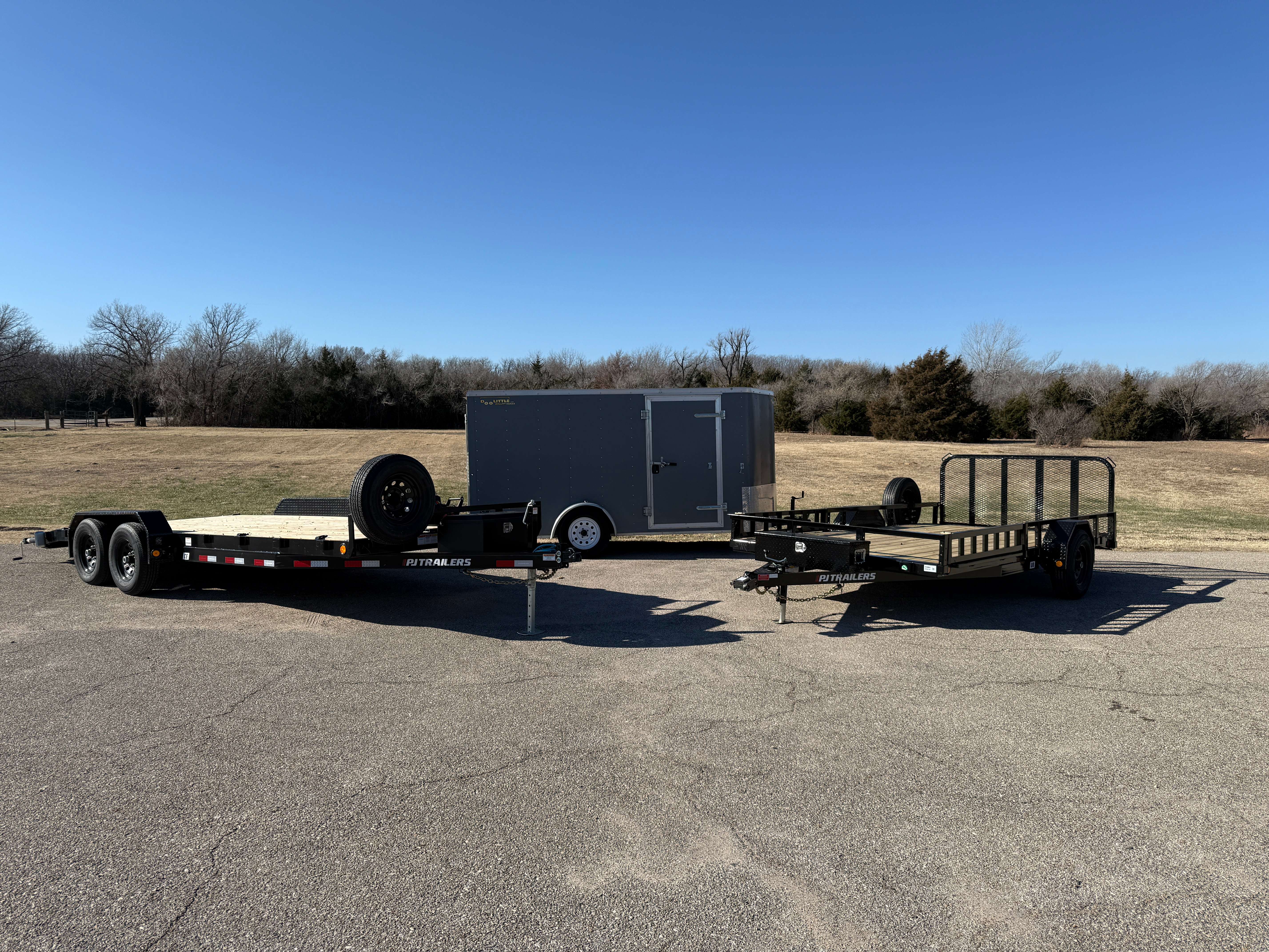 Professional trailer rental fleet including car hauler, enclosed trailer, and utility trailer in Hutchinson Kansas by 3BD Trailer Rentals